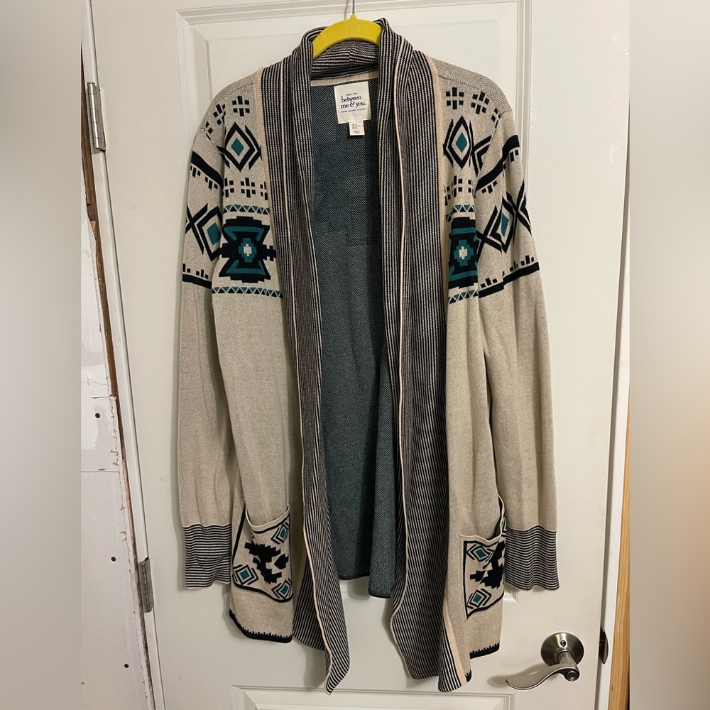 Nice pattern and color, small tear along collar